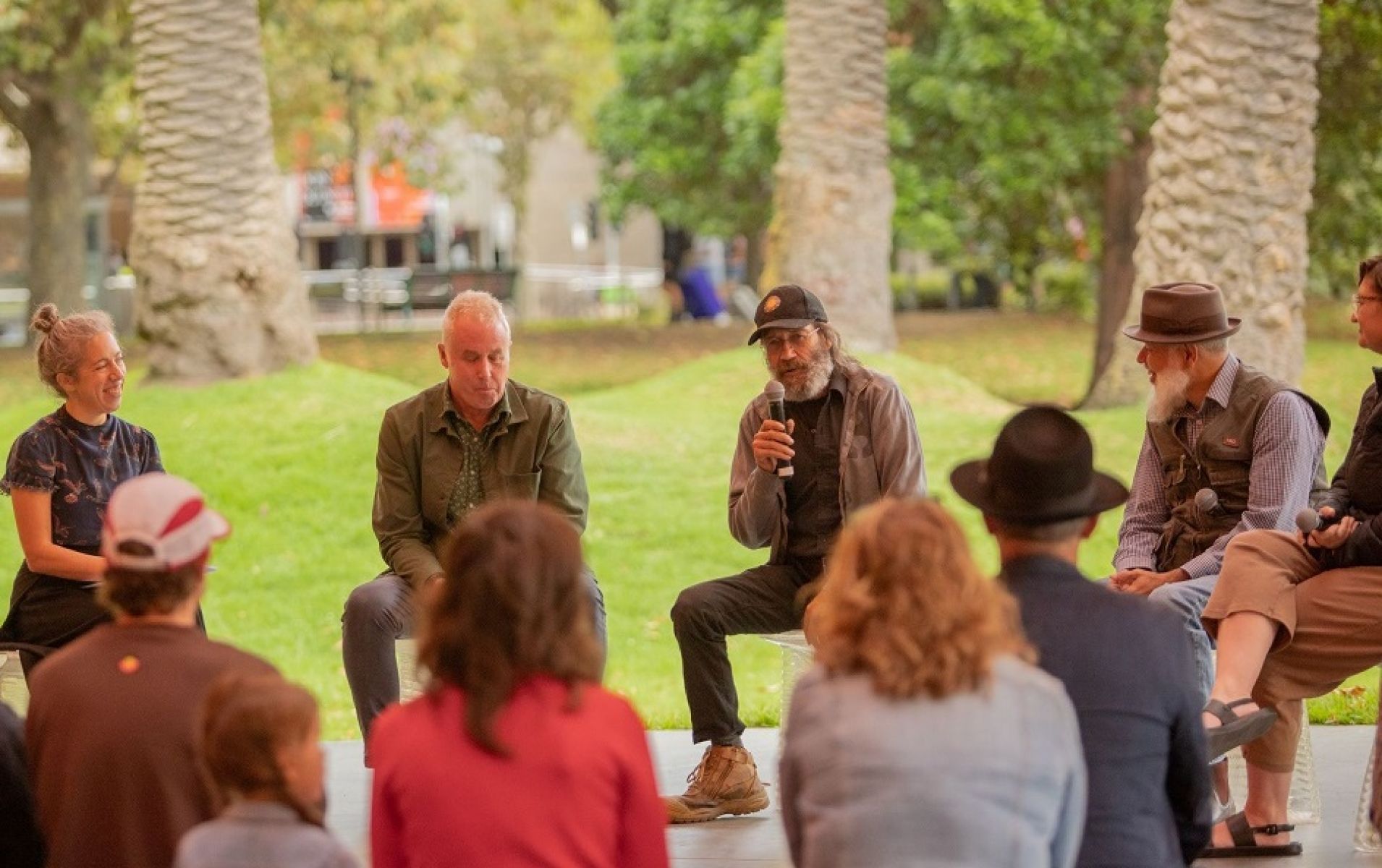 Birrarung Council members seated in a semi-circle speaking at MPavillion